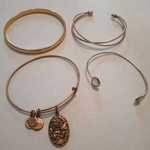 #417.   4 Piece Assorted Gold Toned Bracelets